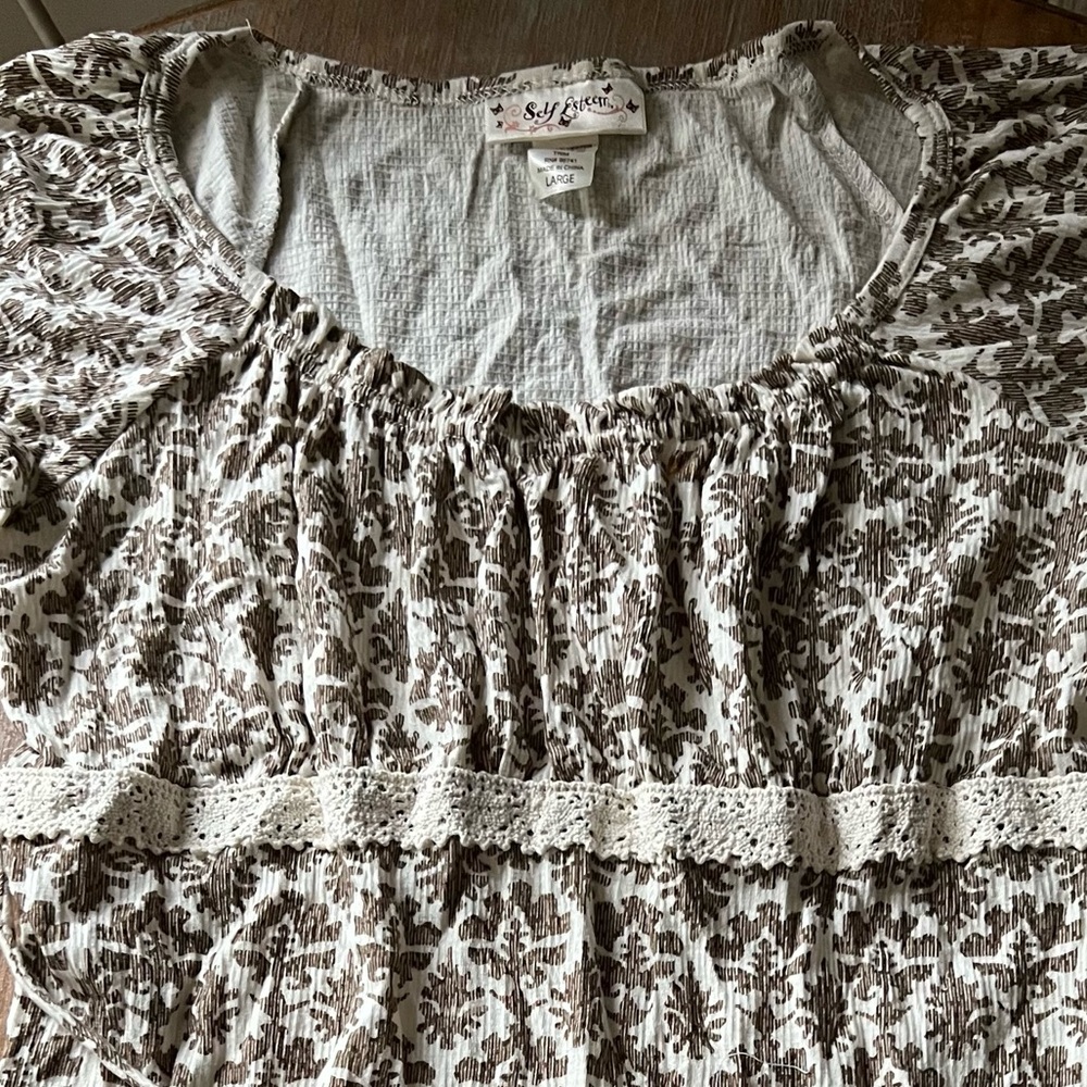 Self Esteem print top with ivory lace trim in Light Taupe. Brand new.Size Large.